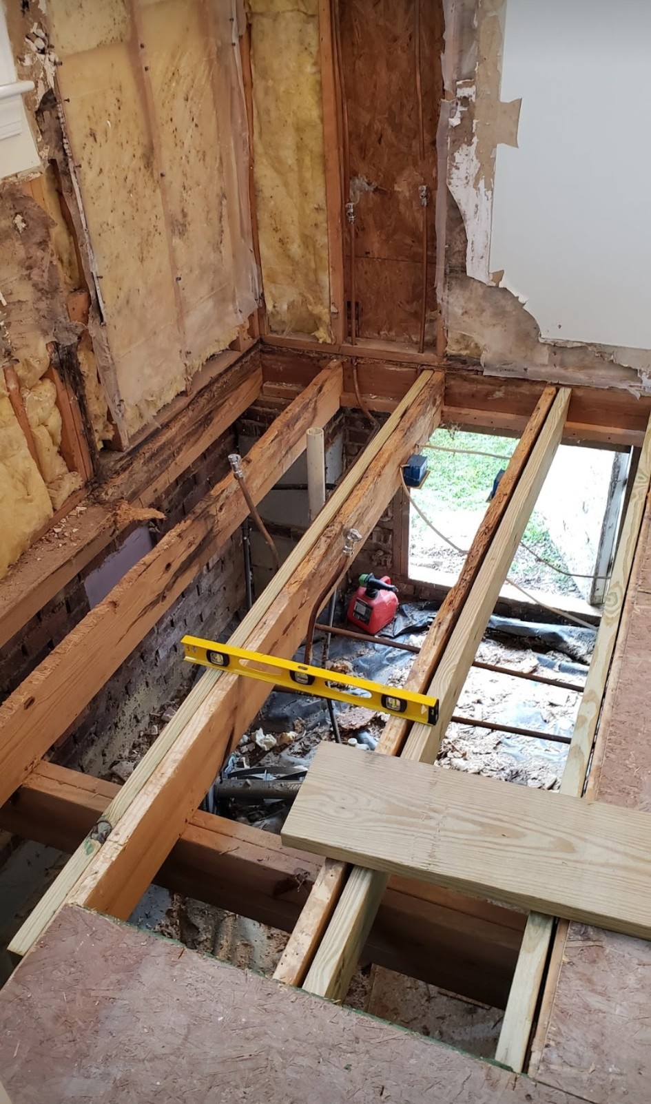 Rotted floor joists replaced with new pressure-treated framing