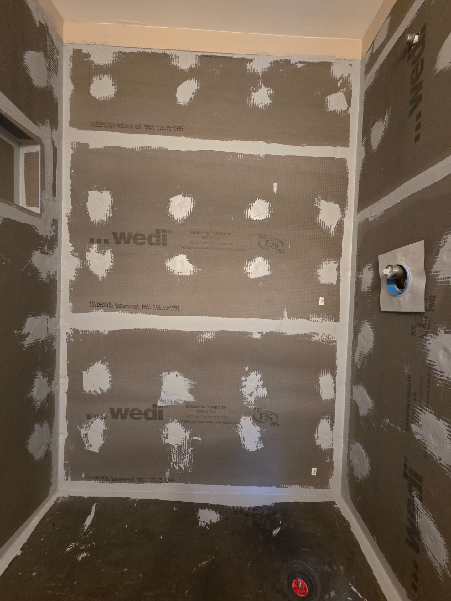 Waterproof shower backer board installed and sealed before tiling